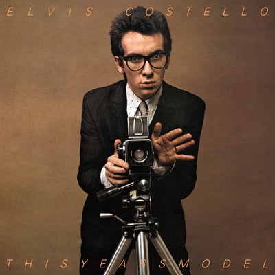 Elvis Costello & The Attractions - I Don't Want To Go To Chelsea / Tiny Steps / Night Rally (Columbia, C4-8292) · 7"