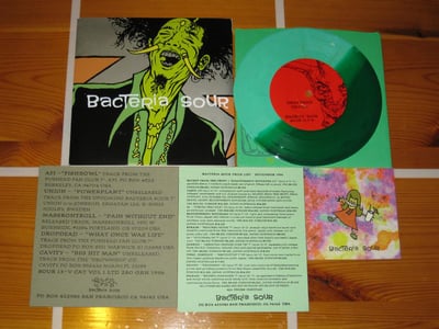 V.A. Bacteria Sour Vol. 1 1996 Bacteria Sour Sour 13-V, Silver Metallic Sleeve, Green Man, Split Green vinyl, #33/45 GREVER