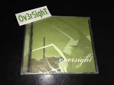Oversight - Somewhere Between Apprehension And Disillusion (2002) Cyclop Media / Sealed