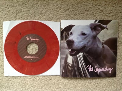 Pet Symmetry -Two Songs About Cars. Two Songs With Long Titles (1st Press, [Random Color] Reddish Pink W/ Specks of Black /779) Asian Man Records