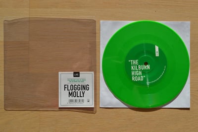 Flogging Molly: The Kilburn High Road / This Present State Of Grace (Uncle M Records 2013 / green) /500