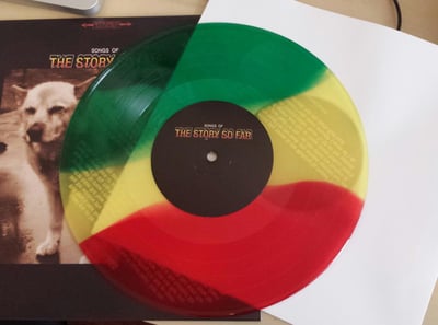 The Story So Far -Songs of (First Pressing /2000 Kelly/Yellow/Blood Red Striped)