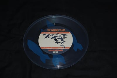 Wonder Years, The - Dismantling Summer 7" | (Clear w/ "Bombs" Screen Printed Thematic Icon - LT 800) [1st on Hopeless Records]