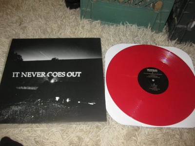 The Hotelier "It Never Goes Out" Tiny Engines. 1st Press. Opaque Red/1000