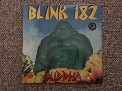 blink-182 | Buddha | 2015 | Clear w/ Yellow/Blue/Green Splatter (Hot Topic pressing which did not retail) | /150 | Sealed