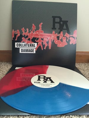 Rude Awakening | Collateral Damage | Red, White, Blue /150 | 1st Press