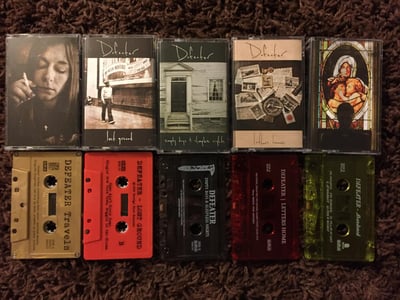 Defeater - 5 Cassette Discography Collection - 73/500 - Travels (Gold), Lost Ground (Opaque Red), Empty Days & Sleepless Nights (Translucent Smokey Gray), Letters Home (Translucent Red), Abandoned (Translucent Yellow)