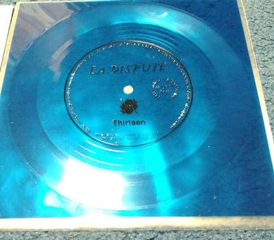 #03 May 2016 La Dispute- Thirteen (Blue) Flexi Subscription Series copy & LLC Lyric Bag