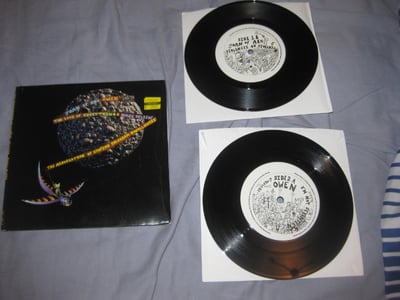 The Love Of Everything/Joan of Arc/Owen/Make Believe/P.D. "The Association of Utopian Hologram Swallowers" Polyvinyl. 2xblack 7"