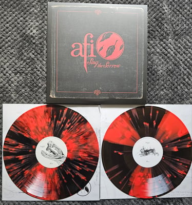 AFI - Sing The Sorrow | 2x12" | Geffen Records/UMG | Translucent Black and Red Pinwheel w/ Red Splatter