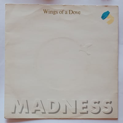 BUY 181 - Madness - Wings Of A Dove - Stiff Records - 7", Single - 1983 - 404890 - Ska, Reggae - 2011-04-24 12:51:00 - Near Mint (NM or M-) - Very Good Plus (VG+)