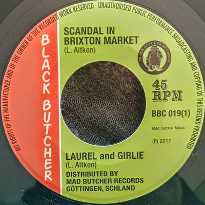 BBC 019 - Laurel Aitken And Girlie (2) - Scandal In Brixton Market / Soul Jerker - Black Butcher Classics - 7", RE - 2017 - 9617822 - Ska, Reggae - 2024-01-10 01:02:31 - Mint (M) - Generic