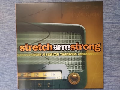 Stretch Arm Strong - A Revolution Transmission [Orange in Yellow w/Black Splatter|#33/300|Smartpunk Excl.]