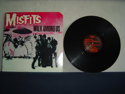 MISFITS: Walk Among Us (1st press with t-shirt order form insert. Promo cut on the sleeve. Pink sky, pink logo)