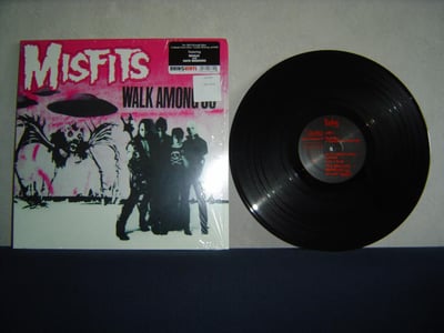 MISFITS: Walk Among Us (5th press with black Ruby labels, pink sky & pink logo w/ "featuring Skulls and Hatebreeders" sticker on shrinkwrap)
